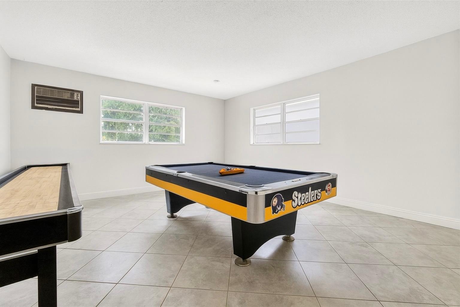 game room with pool table and shuffleboard